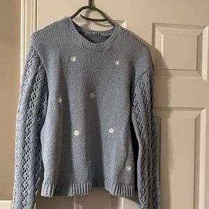 Baby blue sweater with daisies